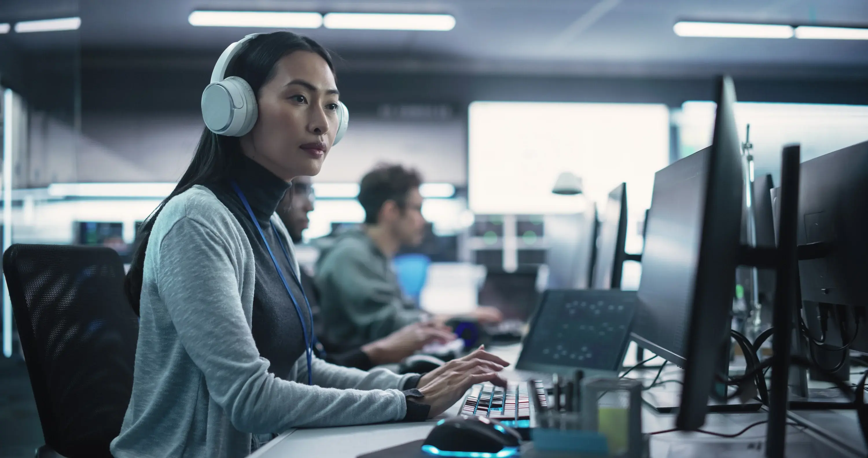 Data center support team working at computers