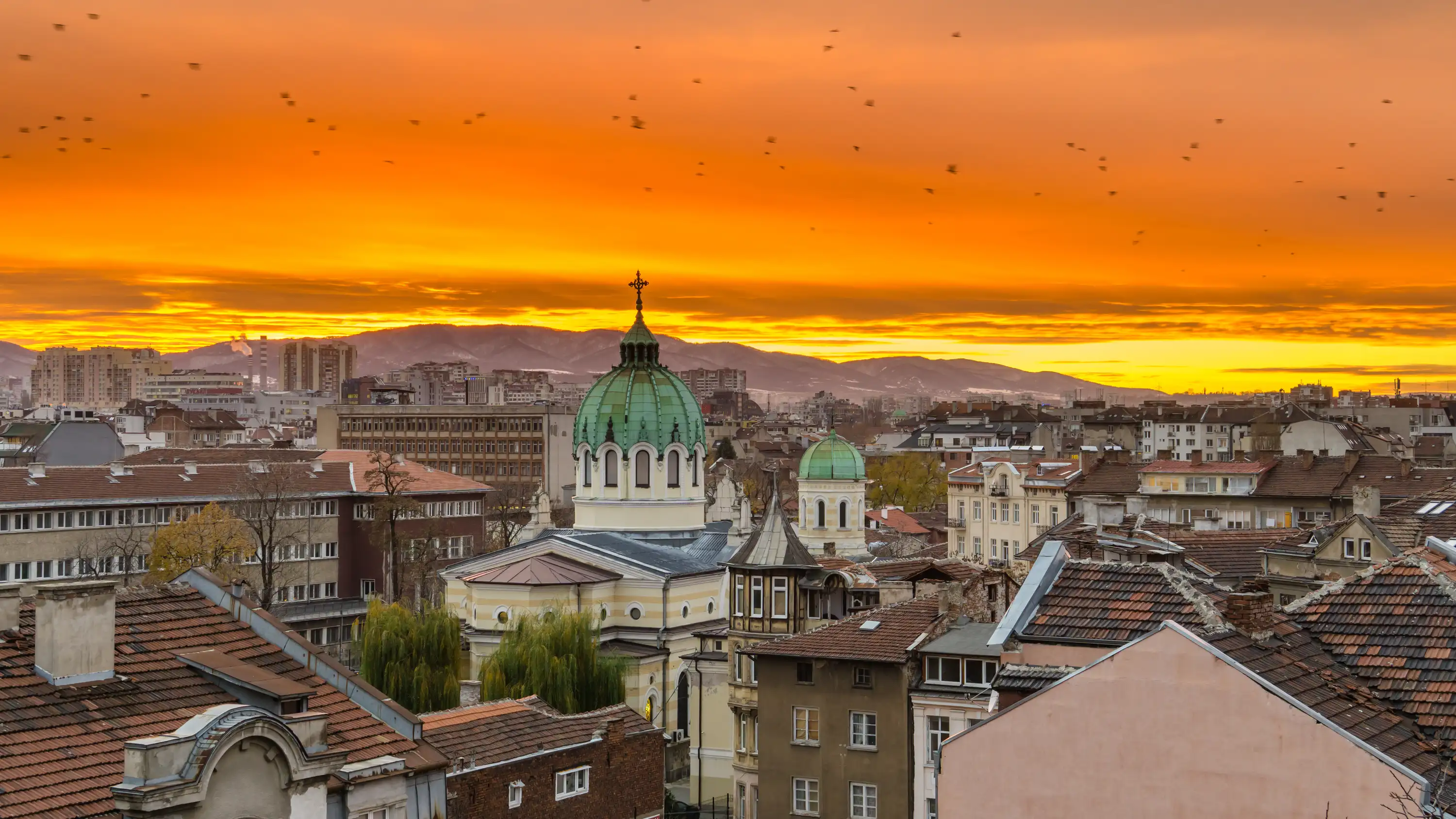 Sofia Bulgaria, sunset skyline with mountains behindjpg